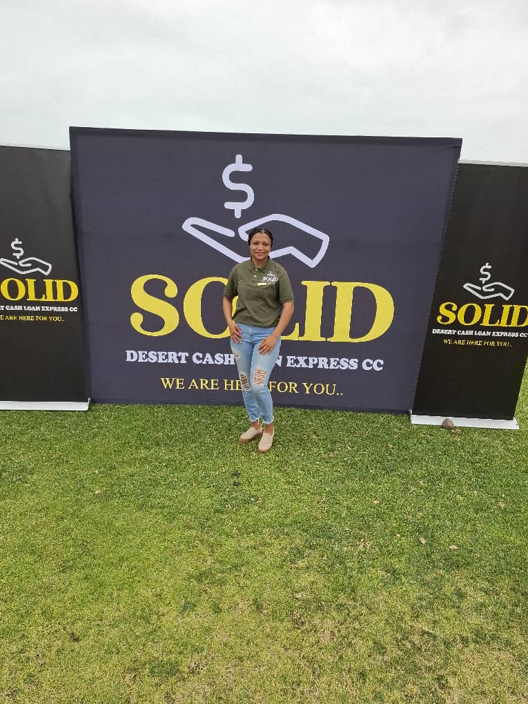 Woman standing with promotional banner