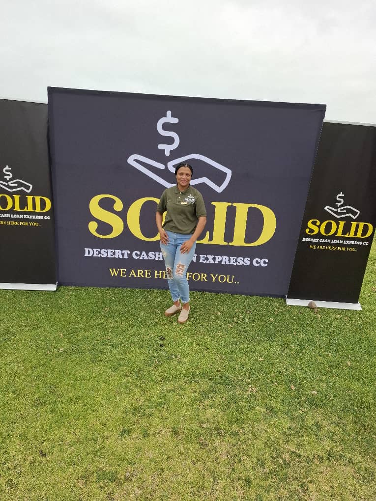 Woman in green branded polo shirt