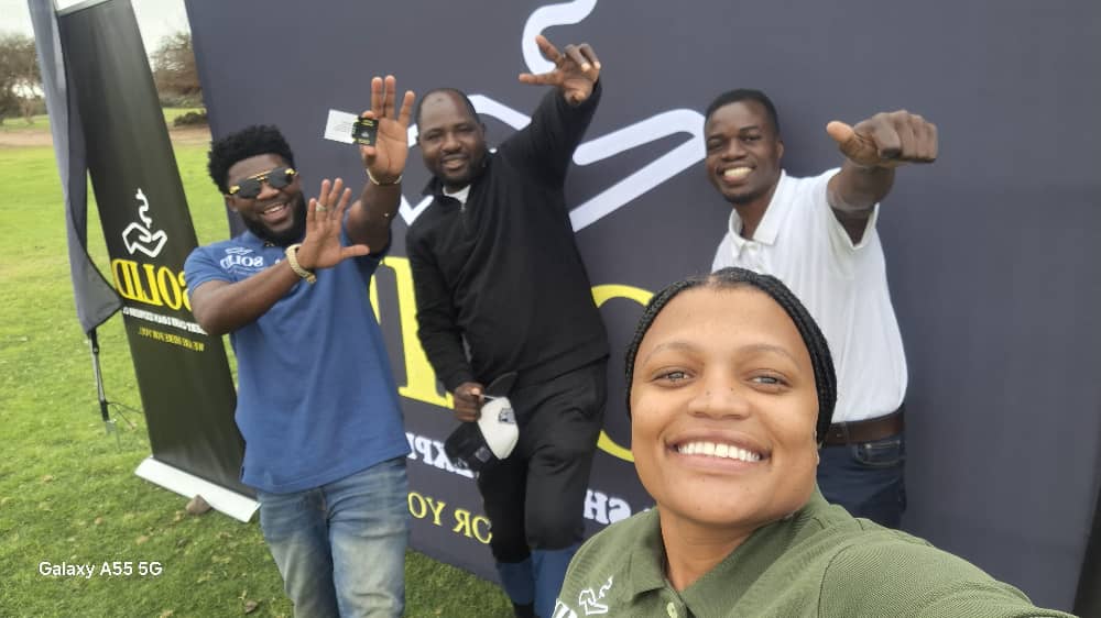 Joyful team selfie with gestures