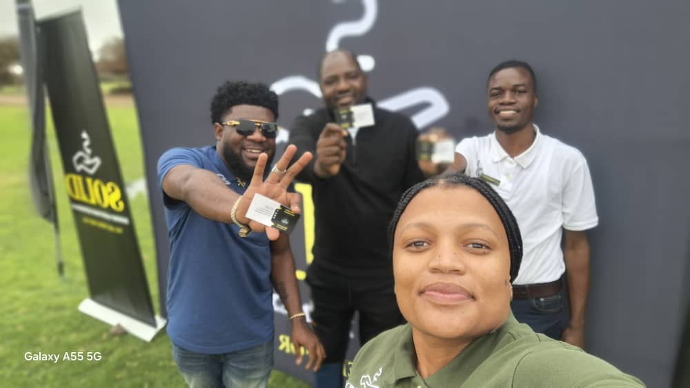 Team selfie with promotional cards