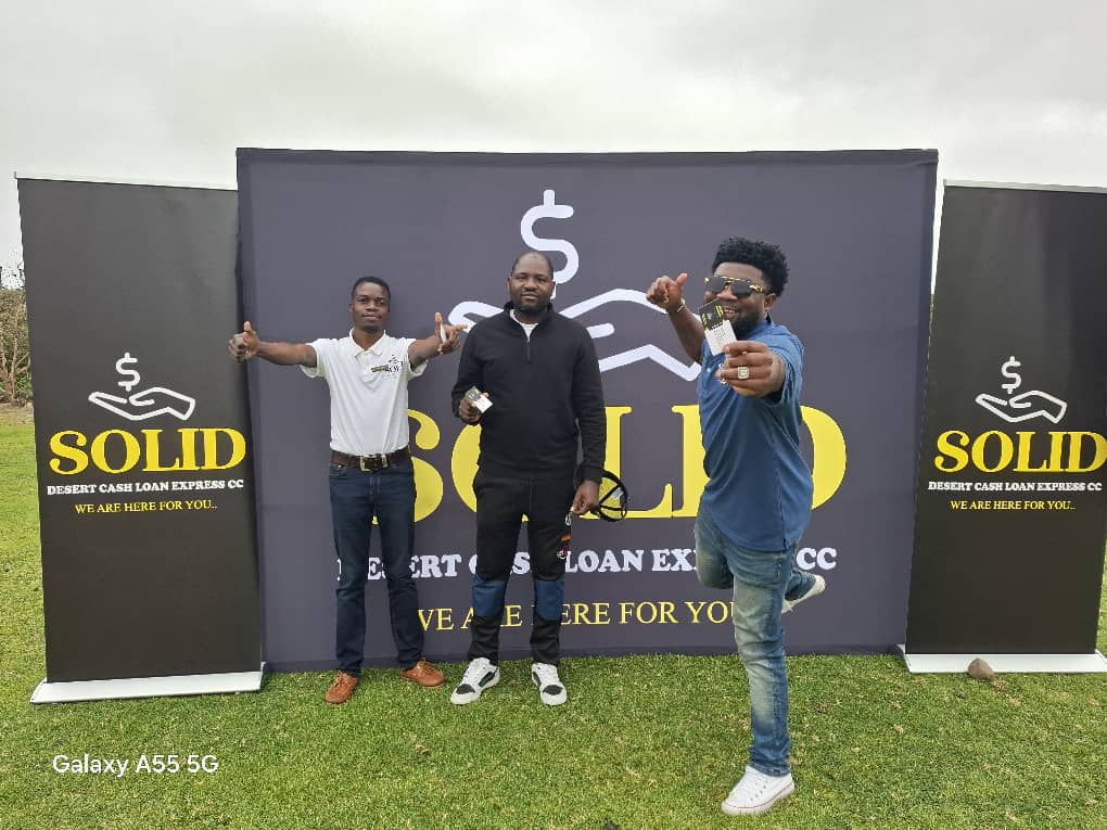 Three men giving thumbs up